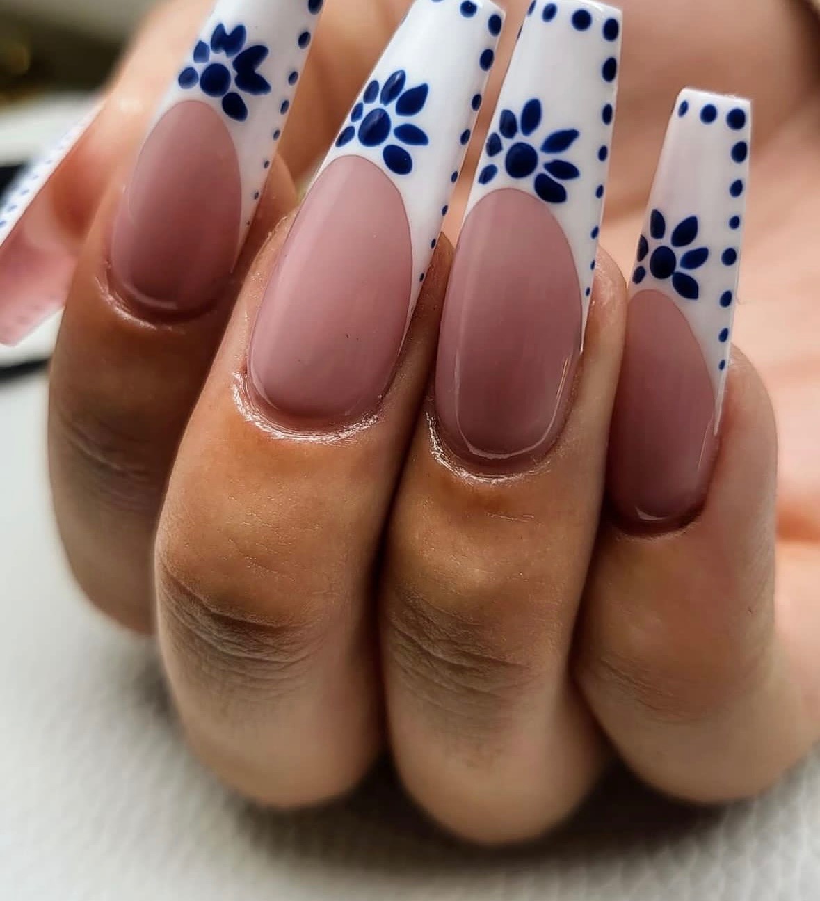 White nails with rhinestone detail